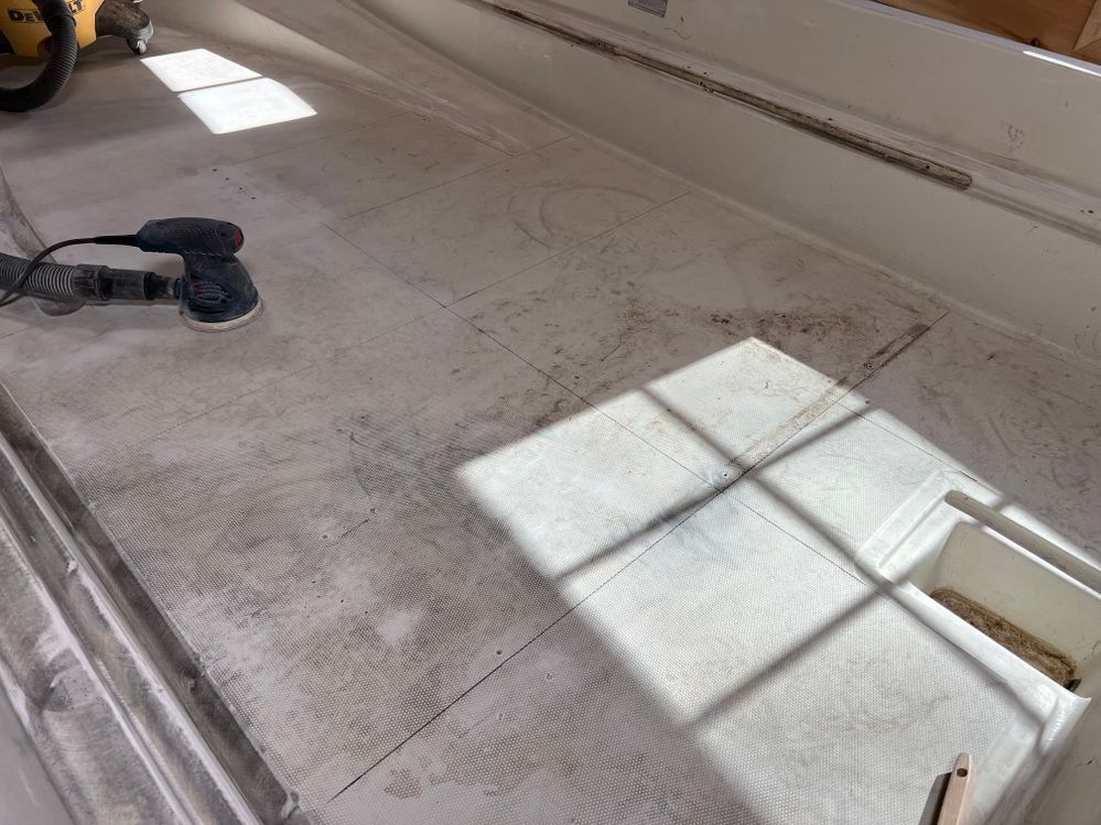 see grid lines on floor, to assure even sanding
